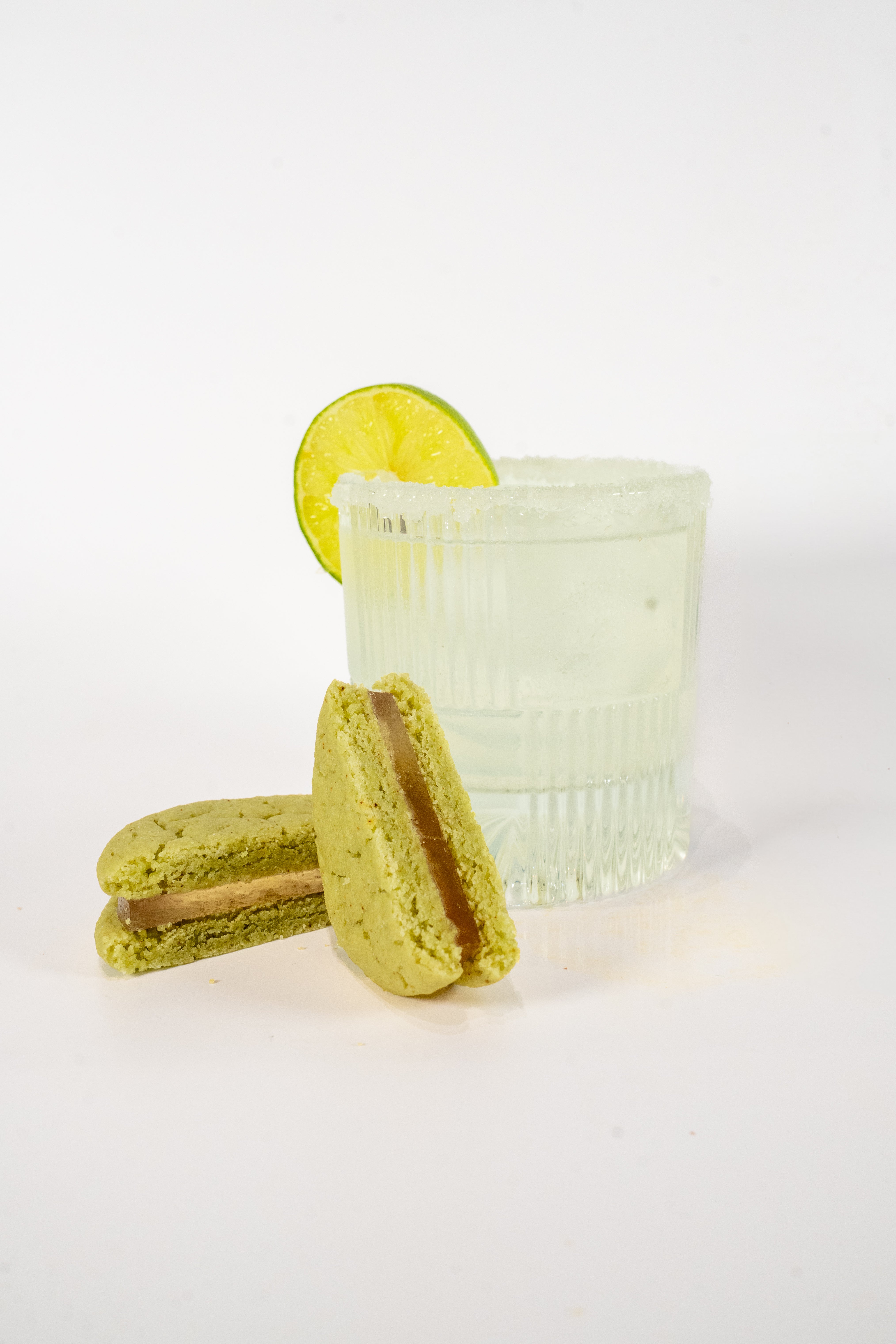 Lime Margarita Cocktail glass next a Royce+Reign zero-proof event favor cookie