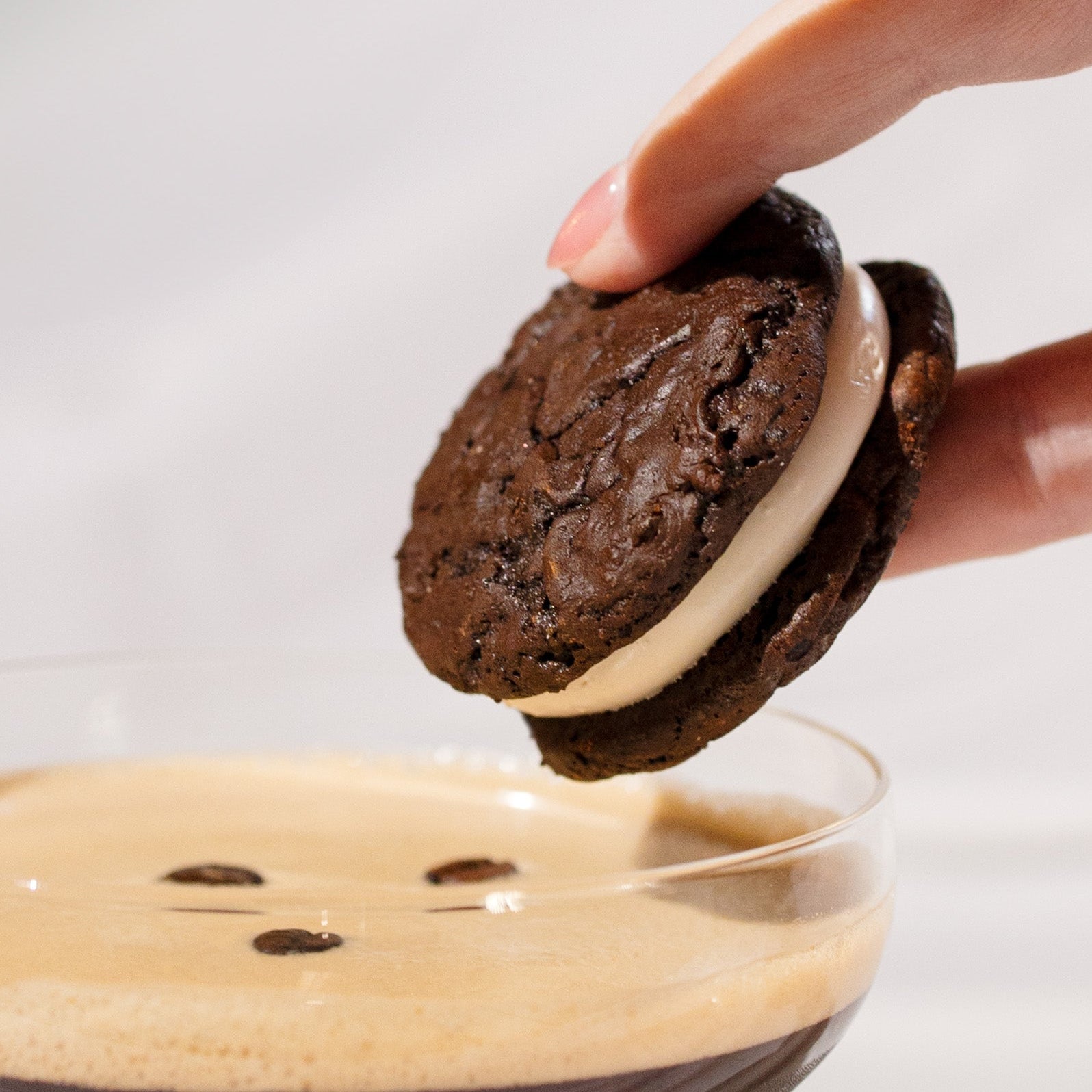 A corporate cookie gits, the Royce + Reign Espresso Martini cookies being dunked into an Espresso Martini